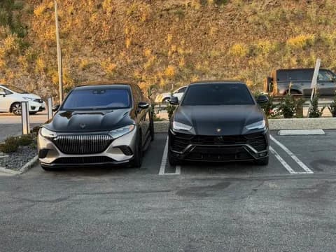 Maybach EQS SUV parked beside a Lamborghini Urus