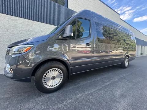 Champagne-tone executive van, side view