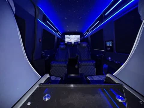 Cabin aisle lit in ambient blue