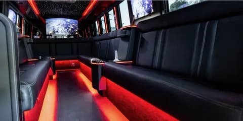 Shuttle bus lounge seating in red ambient light