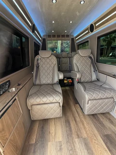 Rear lounge seating in blue ambient light